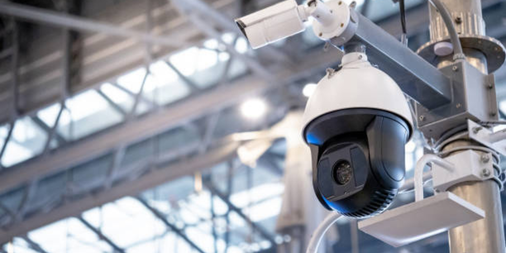 fiber-cctv-camera Image of a CCTV Camera installed inside a building parking lot.